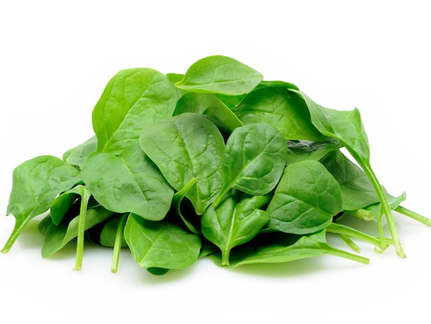 Young spinach leaves in isolated white background